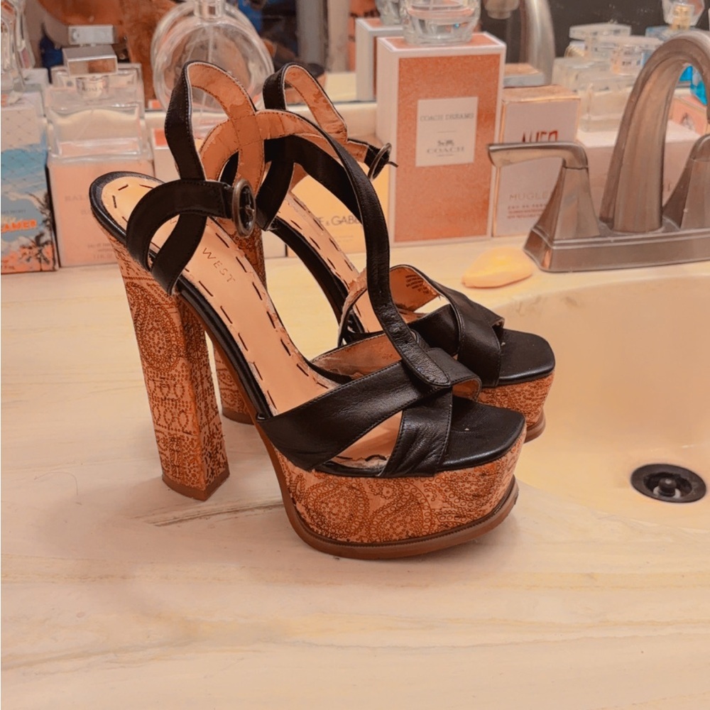 These are 9 West size7 platform sandals w/ black leather and henna designs​